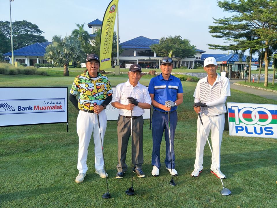 Four Males Standing in front of the Commercial Boards on the Golf Pitch