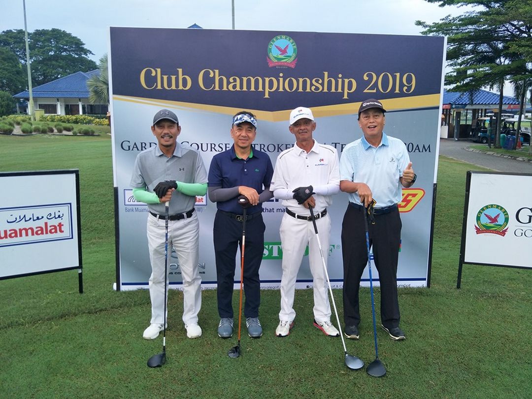 Four Gentleman are Standing and Posing in front of the Golf Club Backdrop