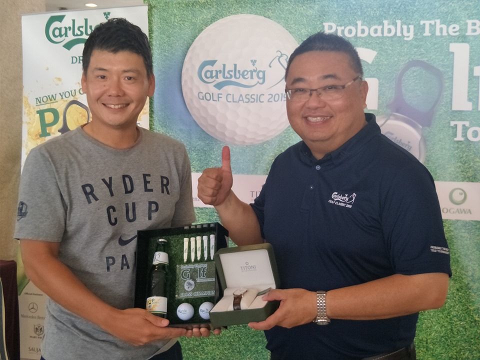 Awarding a prize to a winner at Glenmarie Golf Club