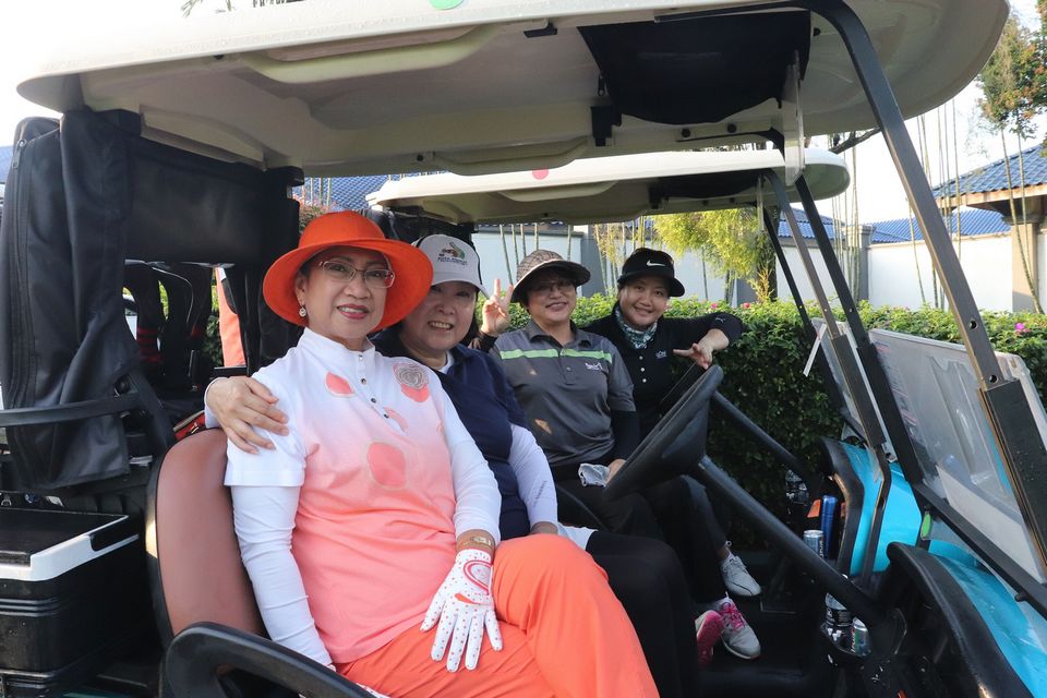 Four Happy Ladies in Golf buggy