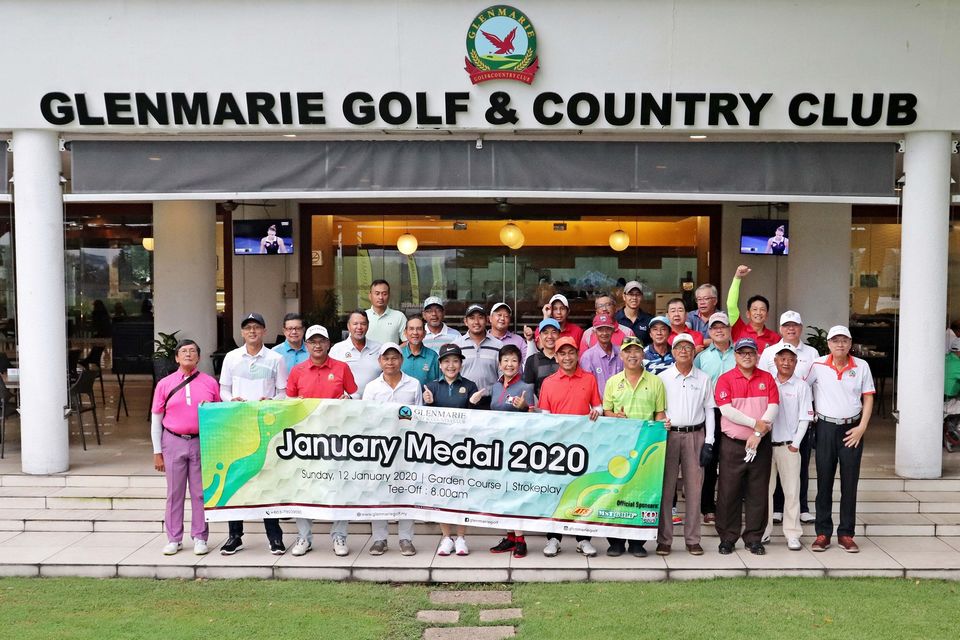 Smiling group with banner at golf club
