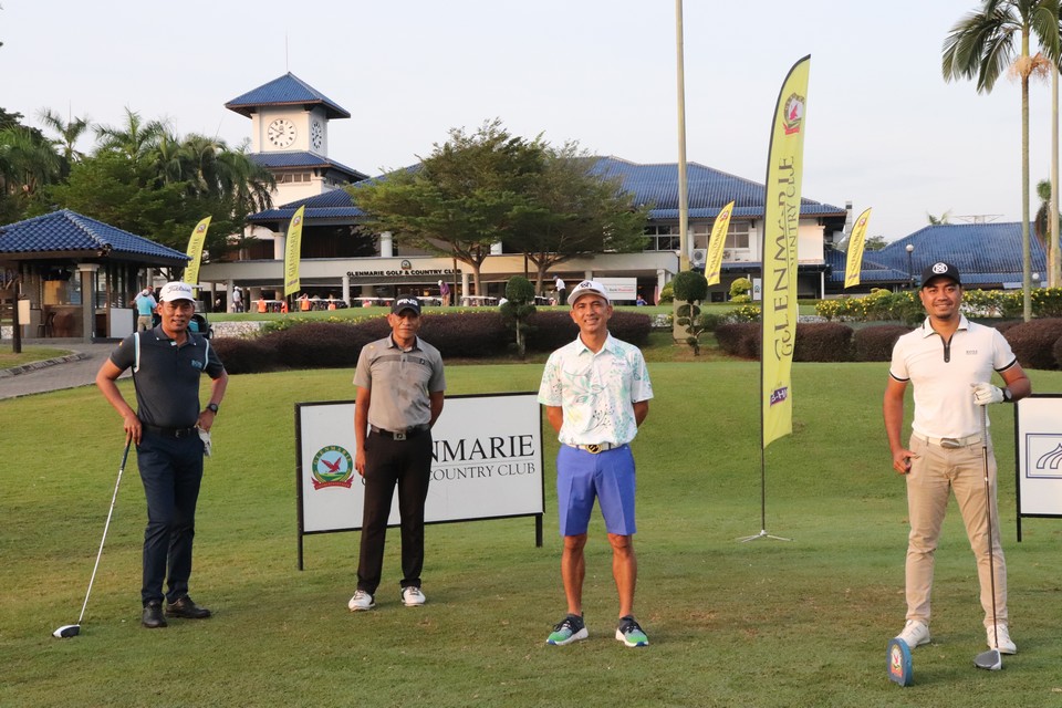 Four male golfers enjoying a round