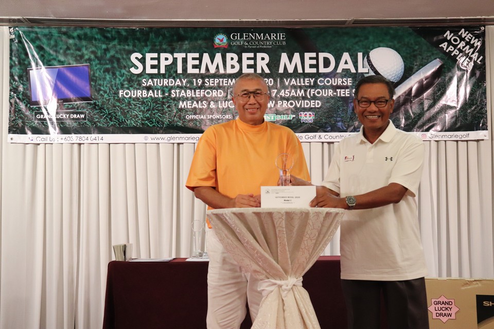 Winner getting awarded at Glenmarie Hotel & Golf Resort Malaysia