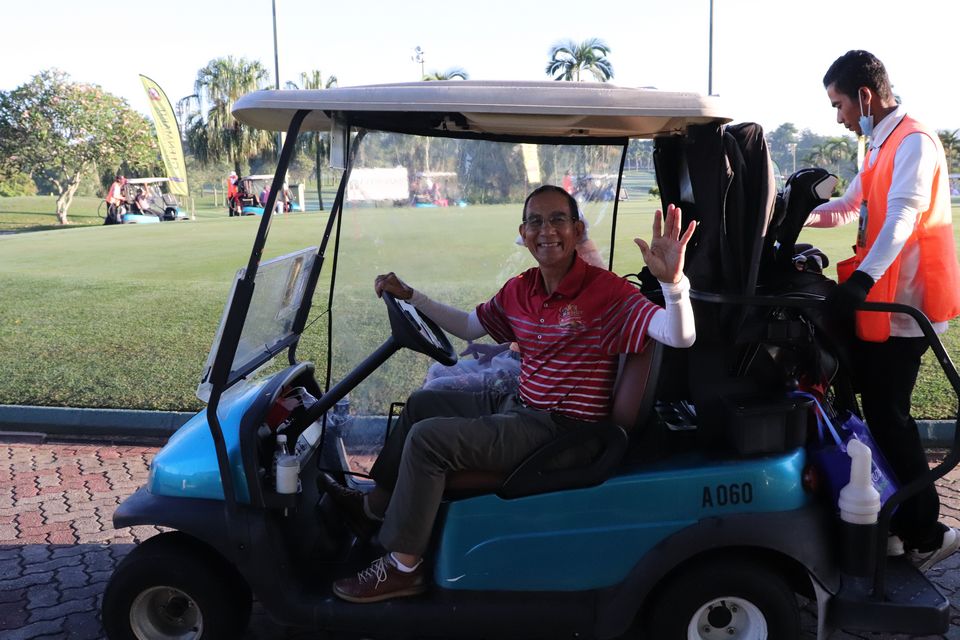 Participant in a Golf Cart at the 7th Member's and Guests Medal 2021