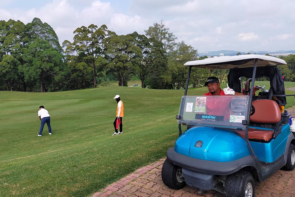 Golfers playing on the background at Glenmarie Hotel & Golf Resort Malaysia